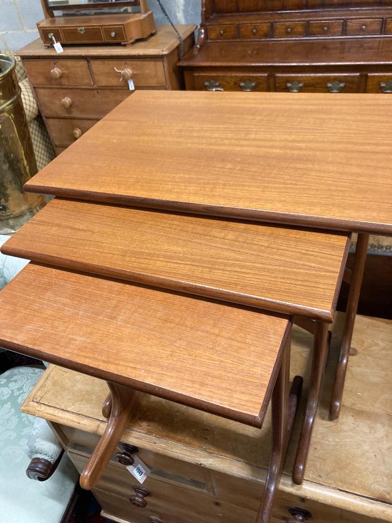 A nest of three G plan teak tables, width 55cm, depth 40cm, height 51cm